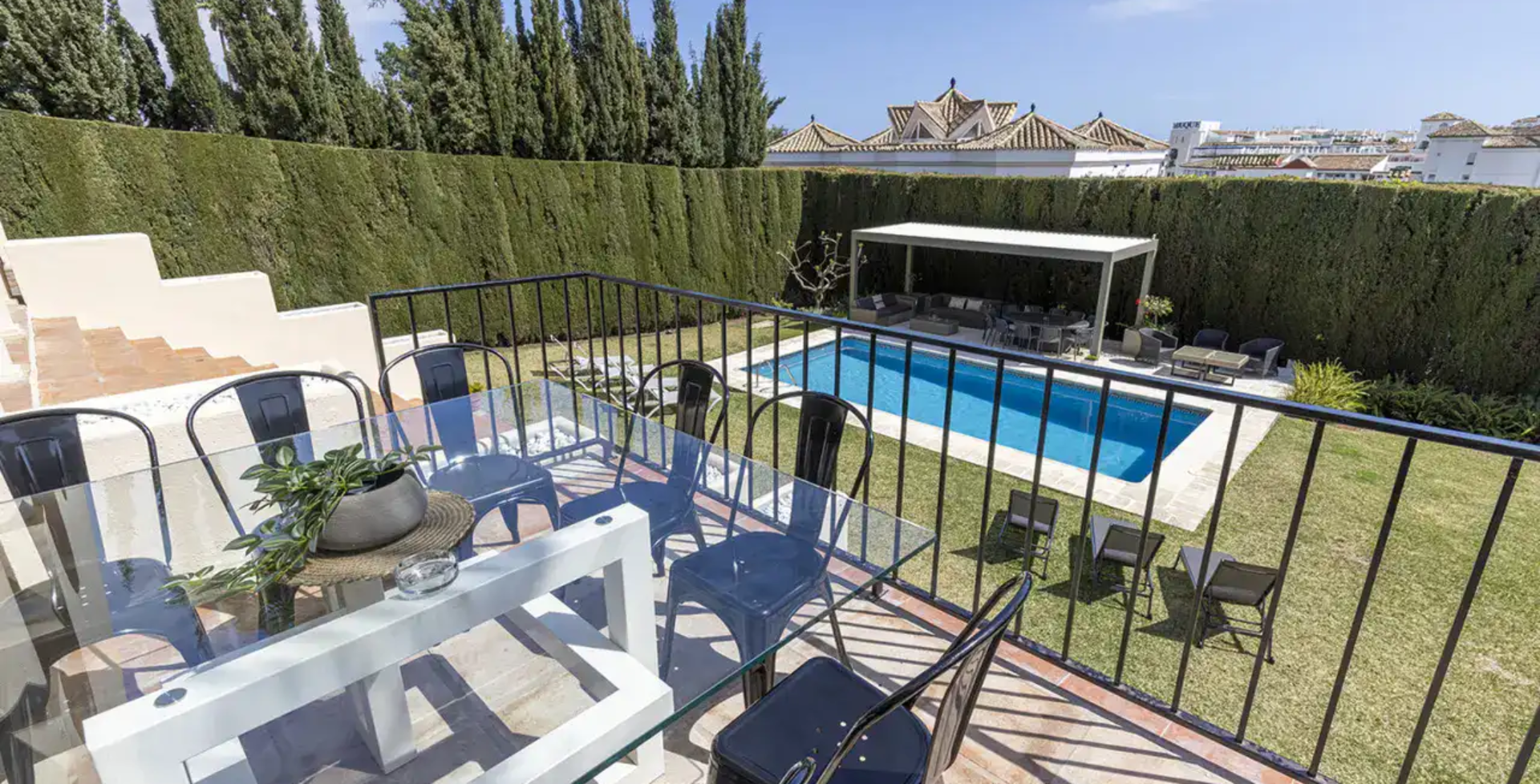 7 bedroom Villa Calle - upper terrace dining view to pool - luxury villas Marbella